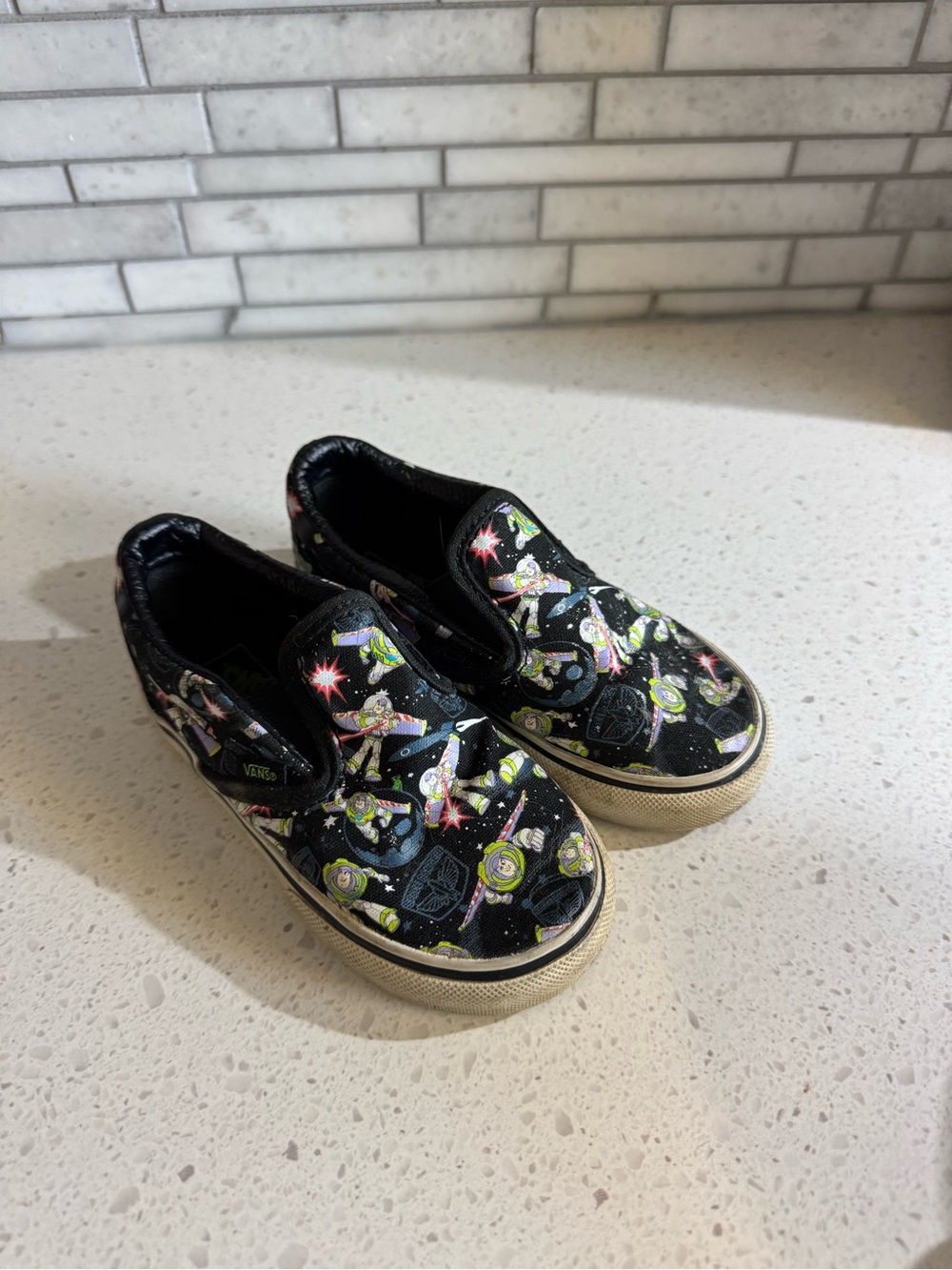 Vans Kids Black Buzz Lightyear Pattern Slip-On Sneakers